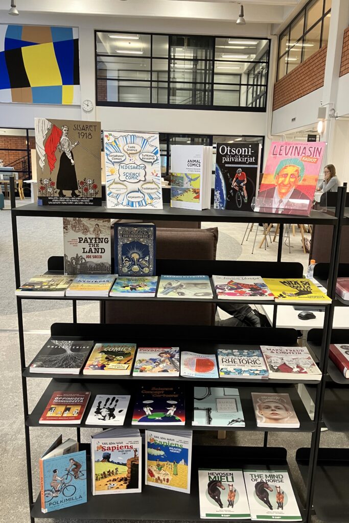 Science comic books on shelves in a library.